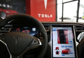 The dashboard of a Tesla Motors autonomous vehicle, unveiled in July 2016 in New York. For the moment, drivers can take back control of the vehicle if required.