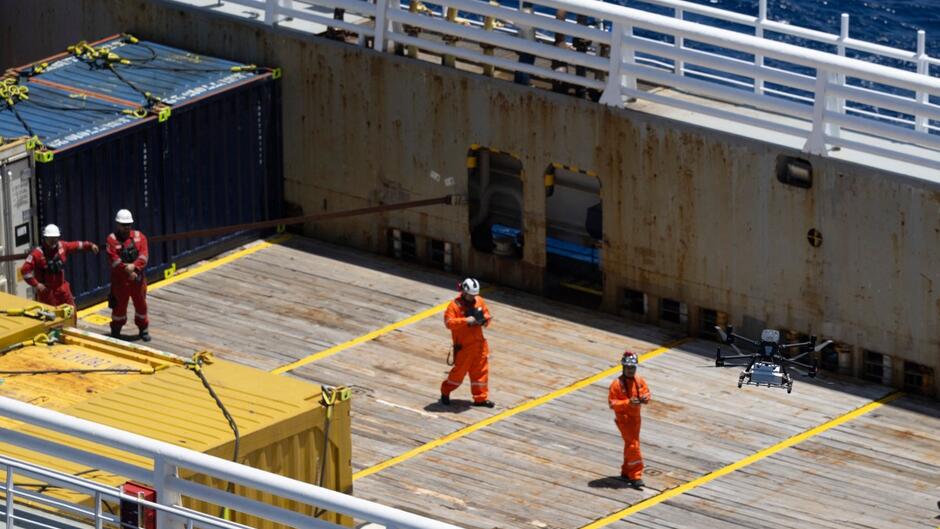 An employee operates a drone to monitor potential methane leaks on an FPSO in Brazil.